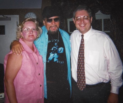Julie and John with a country music Hall of Famer, the late Waylon Jennings.  
