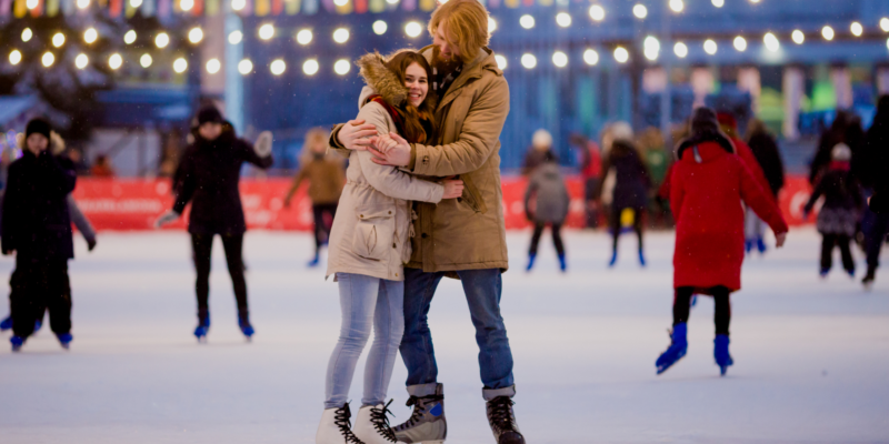 a couple on an ice skating rink