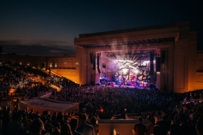 crowd shot of an amphitheater at night