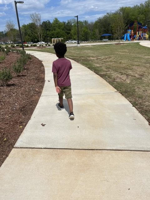 child on sidewalk